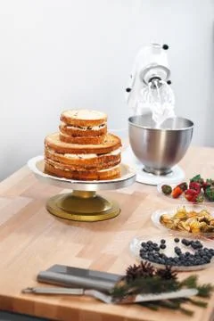 Ingredients for making a cake on a table on a white background Stock Photos