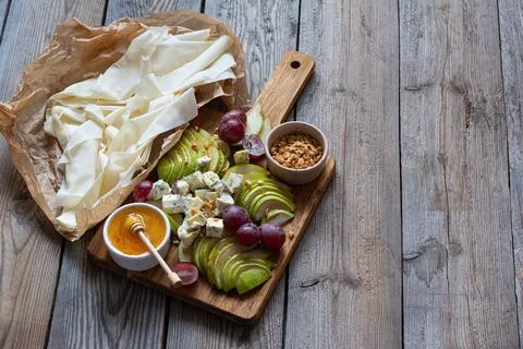 Ingredients for making a phyllo dough tart, fruits (grapes, pears), cheese Stock Photos