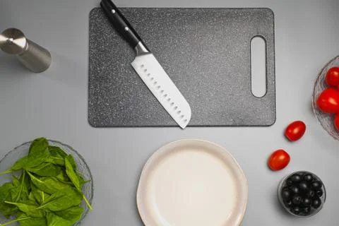 Ingredients for making salad on the kitchen table. The chef cooks the food. Stock Photos