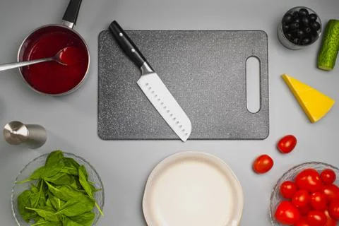 Ingredients for making salad on the kitchen table. The chef cooks the food. Stock Photos