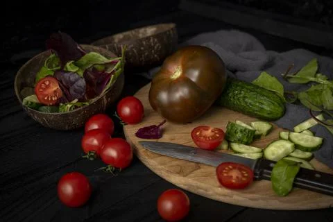 Ingredients for making salad on rustic black board background. Vegetable salad Stock Photos