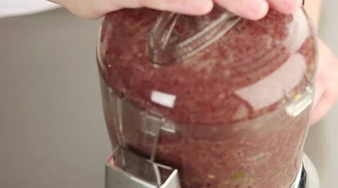 Ingredients for olive paste being pureed in a mixer Stock-Footage 24670584