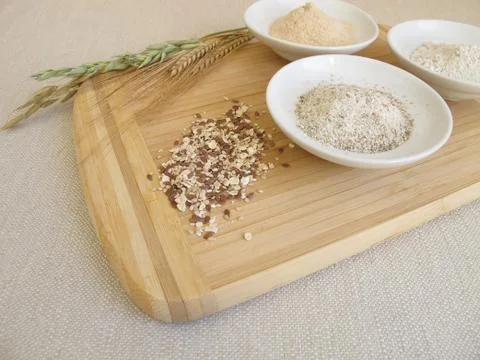 Ingredients for rye bread with rye flour, rye groats, rye sourdough and seed mix Stock Photos