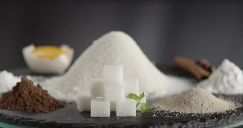 Ingredients spin in a circle flour cocoa egg sugar cinnamon yeast soda Stock Footage 197866262