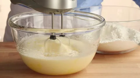 Ingredients for sponge cake being mixed Stock Footage 24657156
