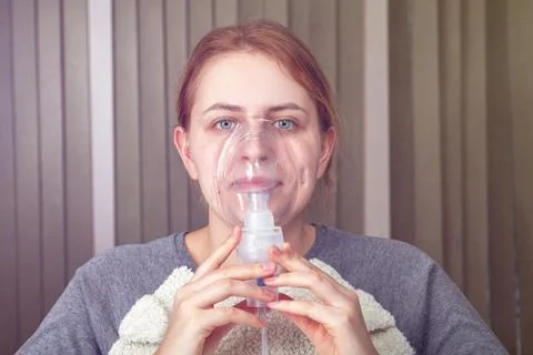 Inhalation with nebulizer during asthma attack. Stock Photos
