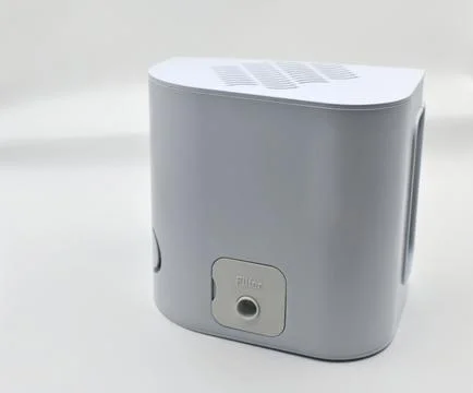 An inhaler is a device for administering Stock Photos