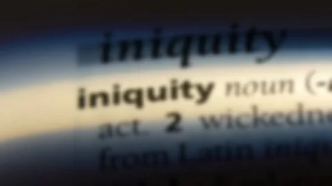 Iniquity word in a dictionary. Stock Footage 99561278
