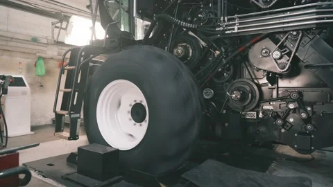Initial adjustment of agricultural tractor or combine harvester in industrial Stock Footage 171580181