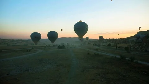 Initial launch. Balloons just off ground and hover in the air gaining altitude. Stock Footage 111308517
