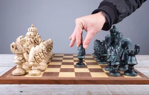 Initial movement of the peon in a chess game with pieces of collection Stock Photos
