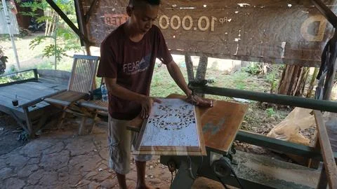 The initial process of making traditional Javanese Gebyok Stock Photos