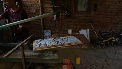 The initial process of making traditional Javanese Gebyok Stock Photos