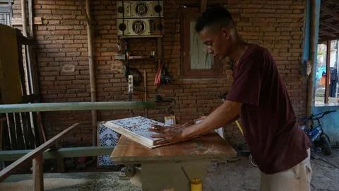 The initial process of making traditional Javanese Gebyok Stock Photos