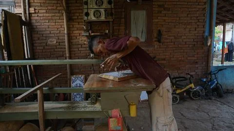 The initial process of making traditional Javanese Gebyok Stock Photos