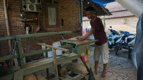The initial process of making traditional Javanese Gebyok Stock Photos