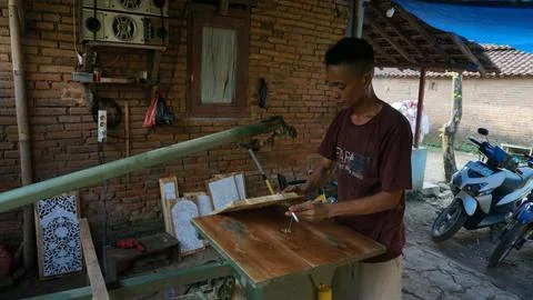 The initial process of making traditional Javanese Gebyok Stock Photos
