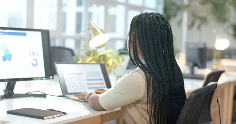 Initiating data entry analyst typing on laptop at desk and verifying charts Stock Footage 317789704