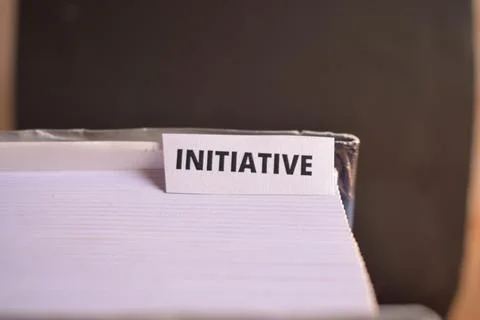 Initiative Text on Paper Tab Inserted in Book for Proactive Mindset and Car.. Stock Photos