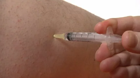 Injecting with a needle Stock Footage 22664203