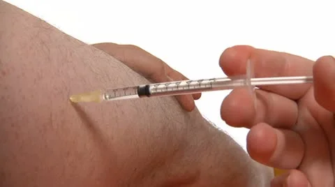 Injecting with a needle Stock Footage 22664205