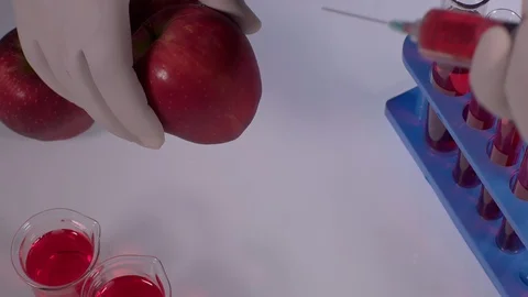 Injecting Red Apple Video stock 123317232