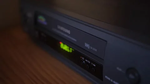 Injecting remove video vhs cassette into video recorder 4k Stock Footage 281868274