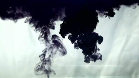 Injection of Black Ink into Clear Water Creating Abstract Flow and Smoke Effect Stock Footage 340654100