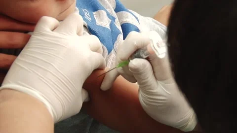 Injection into the child's hand Stock Footage 130793844