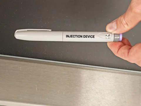 INJECTION DEVICE pharmaceutical dosage form and drug delivery concept held by Stock Photos