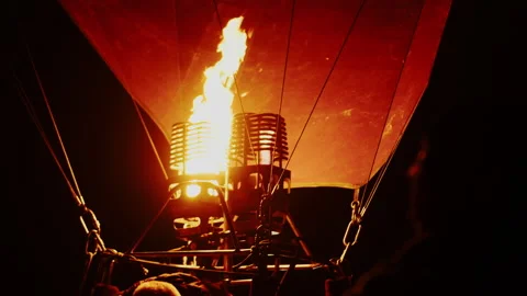 Injection of hot air into balloon before launch at night Stock Footage 196434243