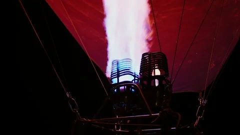 Injection of hot air into balloon before launch at night Stock Footage 196434864