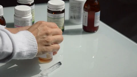 Injection with medicine Stock Footage 94378418
