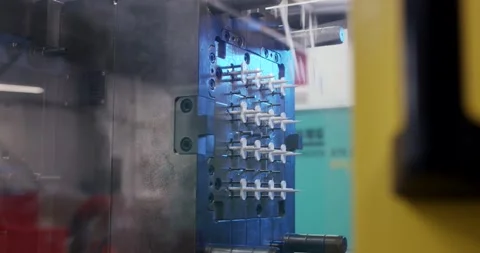Injection Mold Cavities with White Plastic Components, Macro Close Up View Stock Footage 340662181