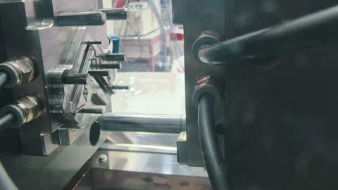 Injection molding machine operation showcasing precision and efficiency during Stock Footage 315418040