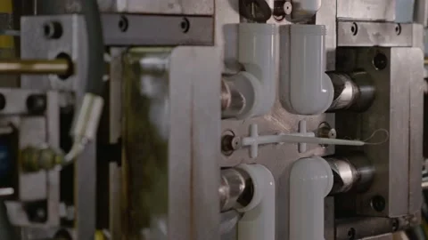Injection molding machine for plastic products during operation. Technology for Stock Footage 231052101