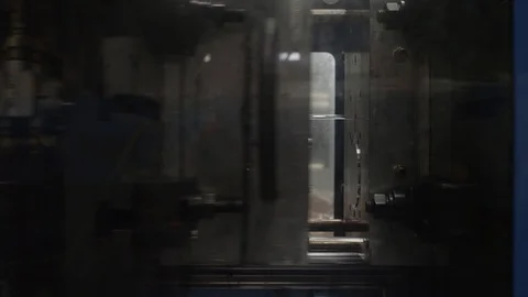 Injection molding machine with robotic arm in American manufacturing factory Stock Footage 129987588