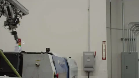 Injection molding machine with robotic arm in American manufacturing factory Stock Footage 130668668