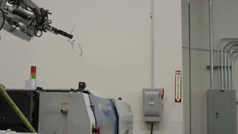Injection molding machine with robotic arm in American manufacturing factory Stock Footage 146921213