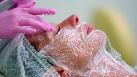 The injection procedure takes place with full concentration, small red marks are Stock Footage 288614405