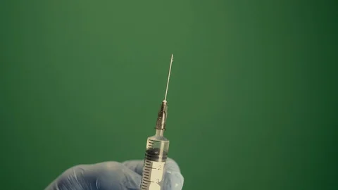 Injection shot syringe rack focus green screen 4K Stock Footage 127211380
