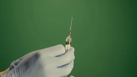 Injection shot syringe rack focus green screen 4K Stock Footage 127211388