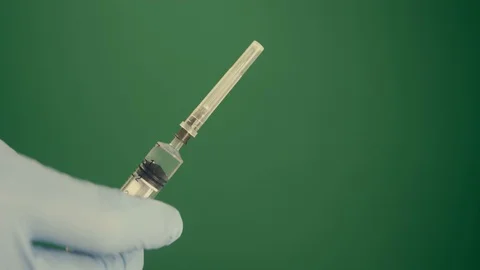 Injection shot syringe rack focus green screen 4K Stock Footage 127211405