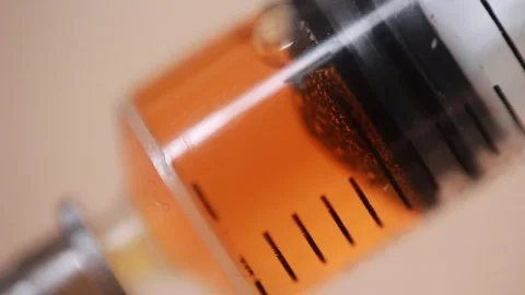 Injection with syringe extreme closeup Stock Footage 86508916