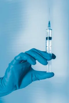 Injection, syringe in hand Stock Photos