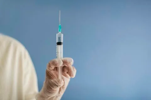 Injection, syringe in hand Foto stock