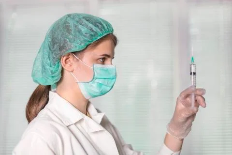 Injection, syringe in hand Foto stock