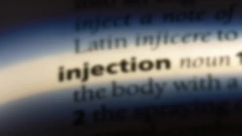 Injection word in a dictionary. Stock Footage 99561317
