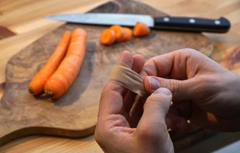 Injured in the kitchen while cooking Stock Photos