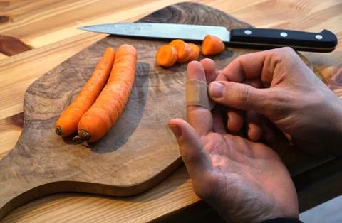 Injured in the kitchen while cooking Stock Photos
